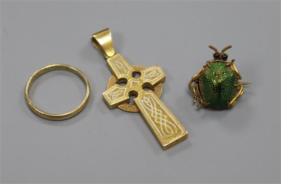 A yellow metal mounted scarab brooch, a Victorian yellow metal and enamel cross pendant and a 9ct gold band.